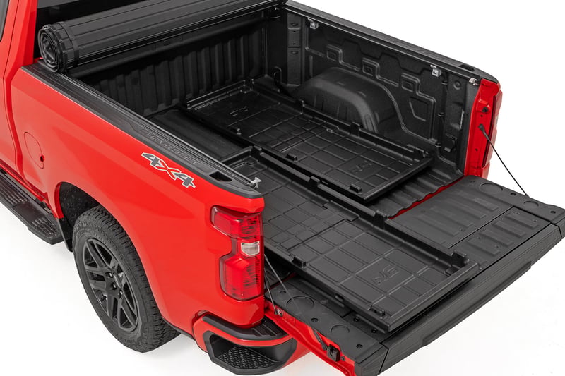 Rough Country slide-out cargo trays holding a cooler in a pickup bed